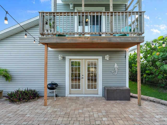 back of house with french doors and a patio area