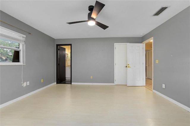 spare room featuring ceiling fan and light wood-type flooring