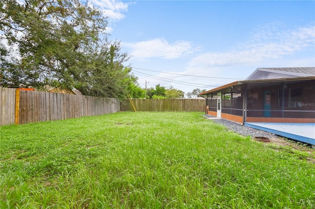 view of yard with a sunroom