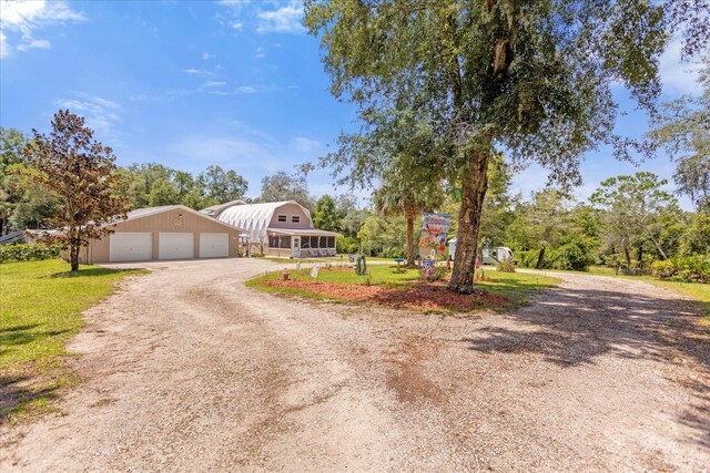 view of front of property featuring an outbuilding and a garage