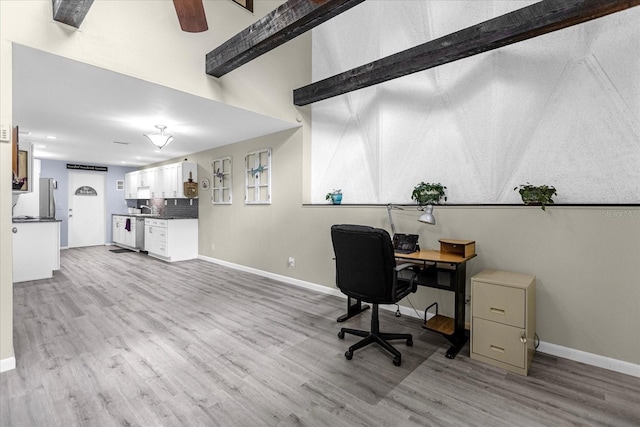 office area featuring light wood-style flooring and baseboards