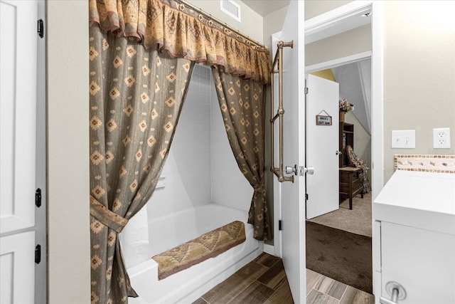 bathroom featuring shower / bathtub combination with curtain