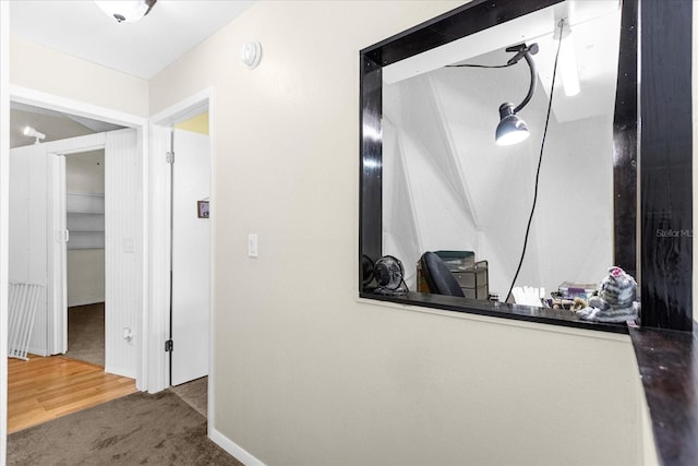 hallway with carpet flooring