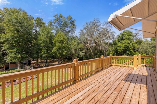 deck featuring a lawn