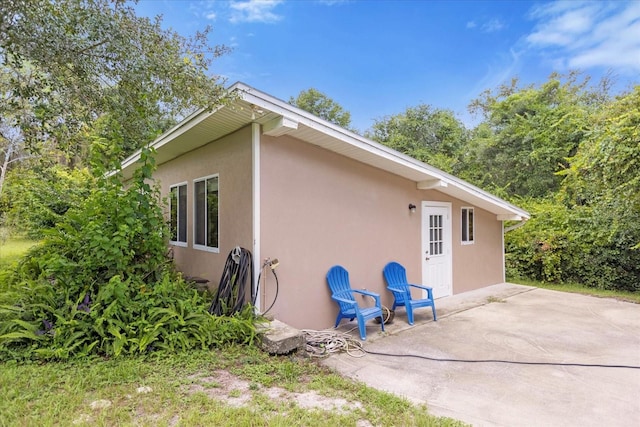 view of property exterior featuring a patio and stucco siding