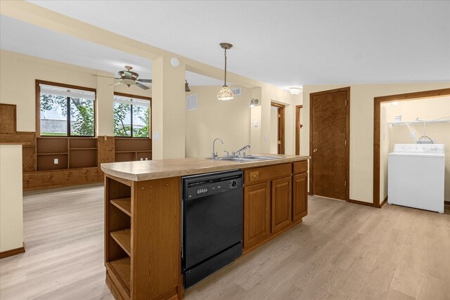 kitchen with dishwasher, an island with sink, light hardwood / wood-style floors, washer / clothes dryer, and sink