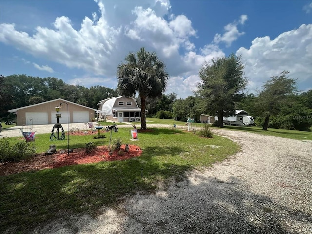 view of yard featuring an outbuilding and a garage