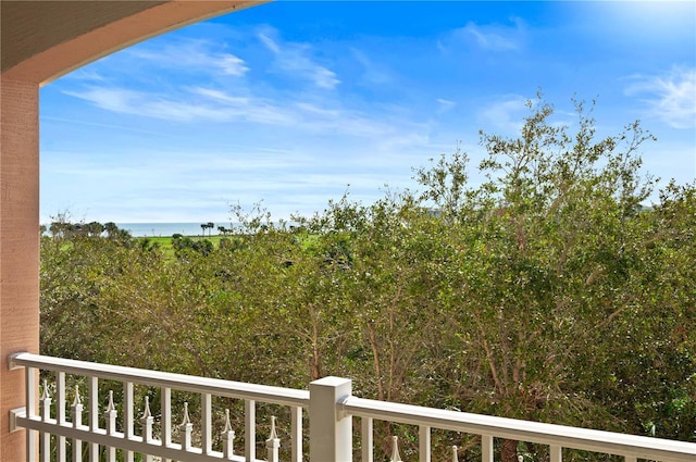 view of yard featuring a water view and a balcony