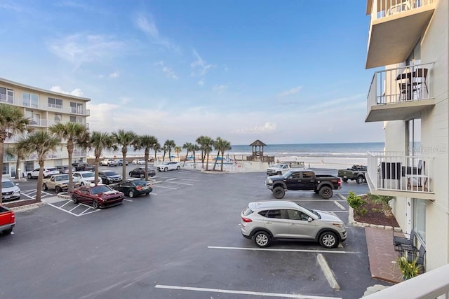 view of parking with a water view