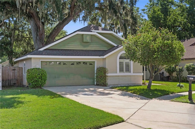 view of front of home with a garage and a front yard