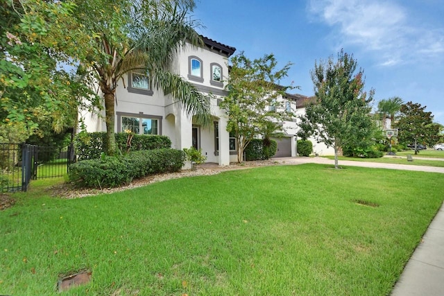 view of front of property with a garage and a front yard