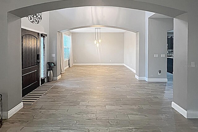 foyer entrance with hardwood / wood-style flooring