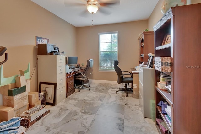 tiled office space featuring ceiling fan