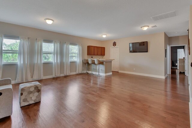 unfurnished living room featuring hardwood / wood-style floors