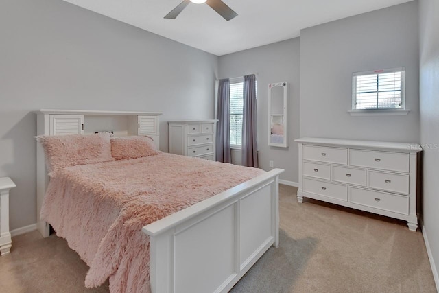 bedroom featuring ceiling fan and carpet