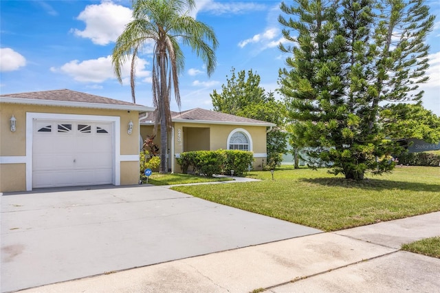 view of front facade with a front lawn and a garage