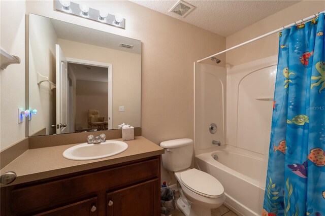 full bathroom with toilet, a textured ceiling, tile patterned flooring, vanity, and shower / tub combo