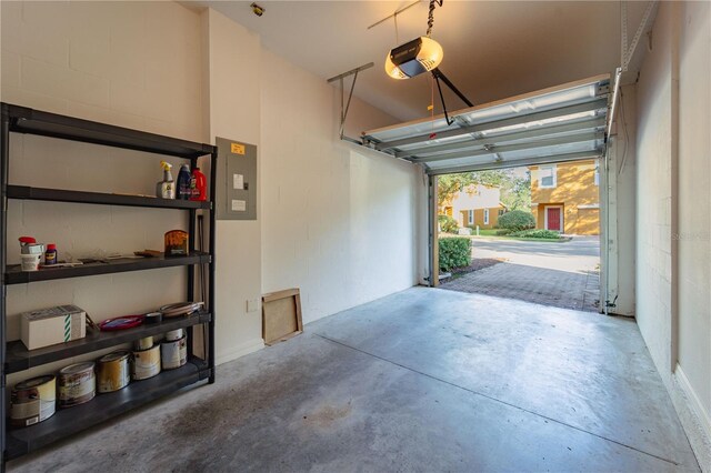 garage featuring a garage door opener and electric panel