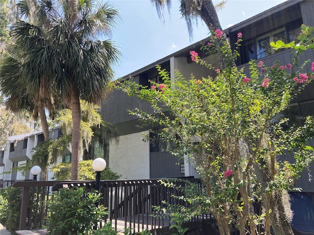 view of side of property with a balcony