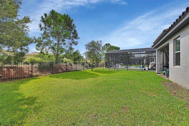 view of yard with a pool and glass enclosure