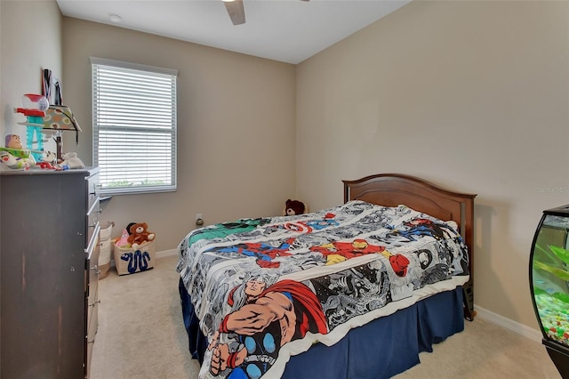 carpeted bedroom featuring multiple windows and ceiling fan