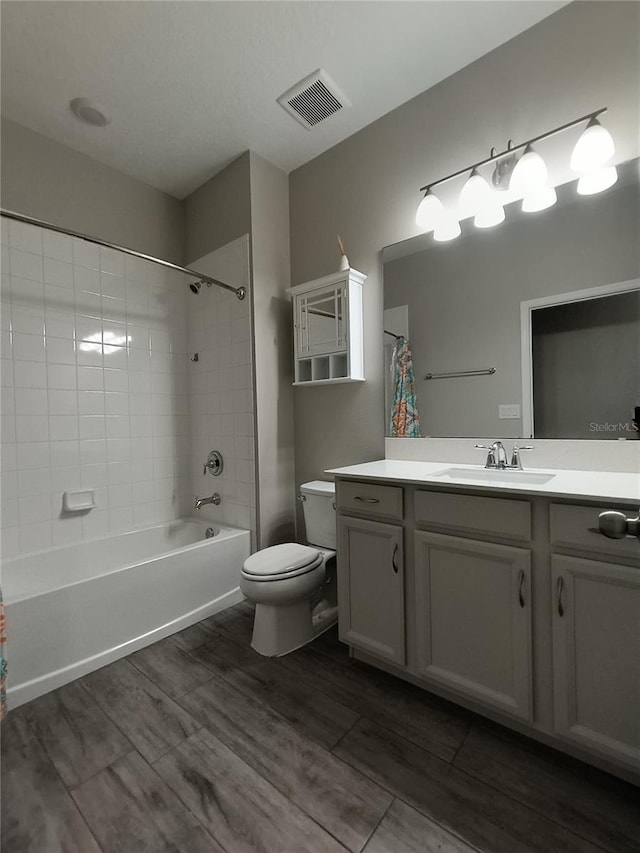 full bathroom featuring vanity, toilet, and shower / bath combo with shower curtain