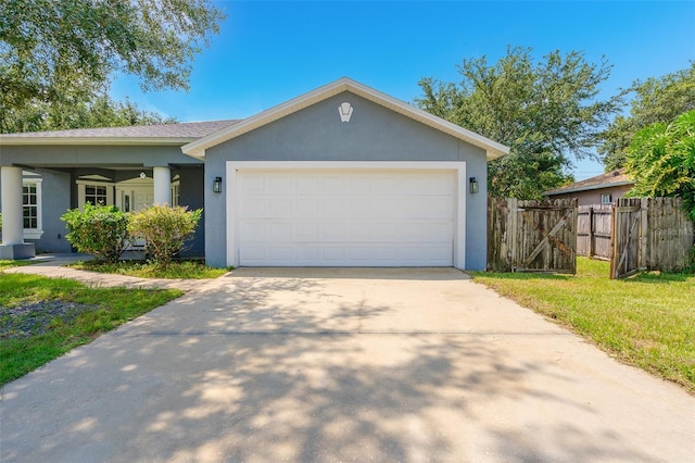 single story home with a front yard and a garage