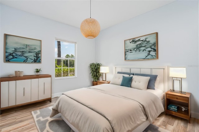 bedroom featuring light wood-style flooring