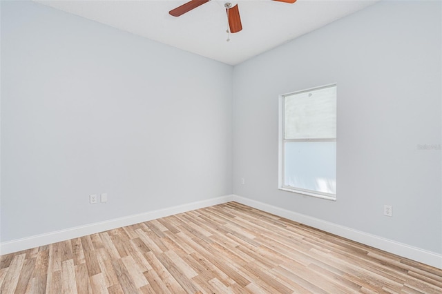 unfurnished room featuring ceiling fan, wood finished floors, and baseboards