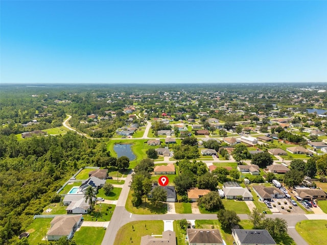 birds eye view of property with a residential view and a water view