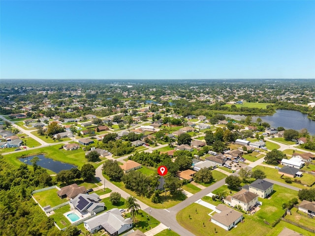 bird's eye view with a water view and a residential view