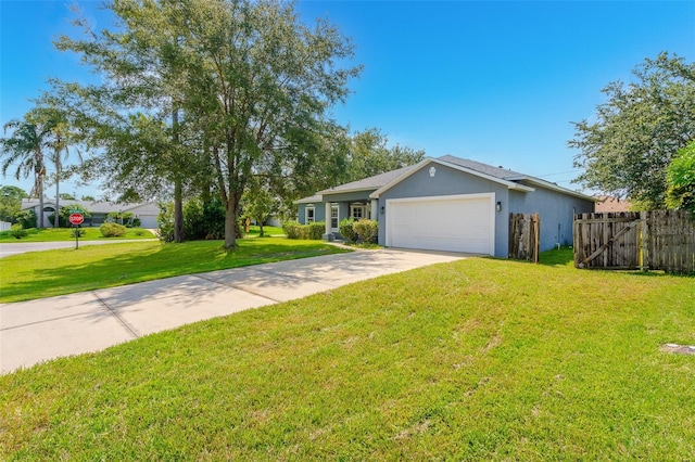 single story home with driveway, an attached garage, fence, a front lawn, and stucco siding