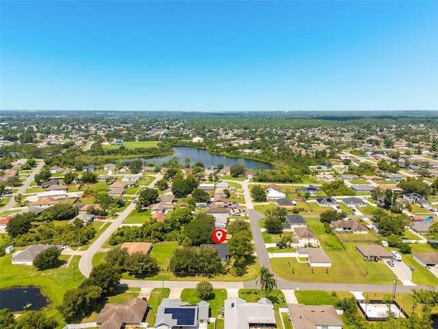 bird's eye view featuring a water view and a residential view