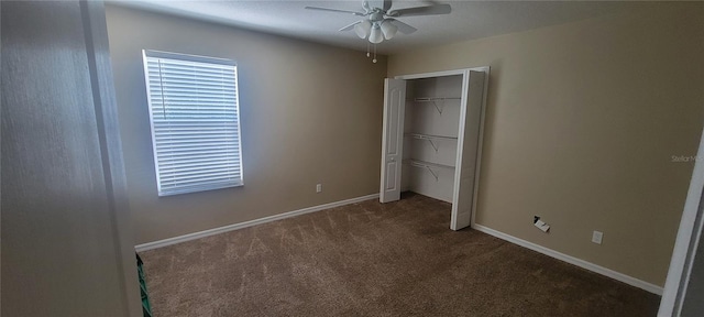 unfurnished bedroom with carpet floors, ceiling fan, and a closet