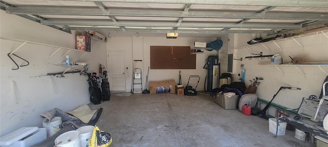 garage with a garage door opener and electric panel