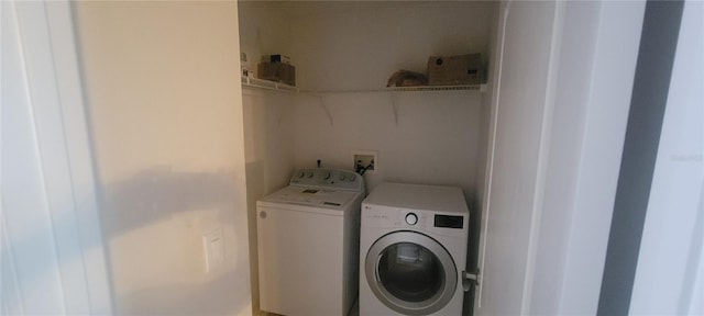 clothes washing area with independent washer and dryer