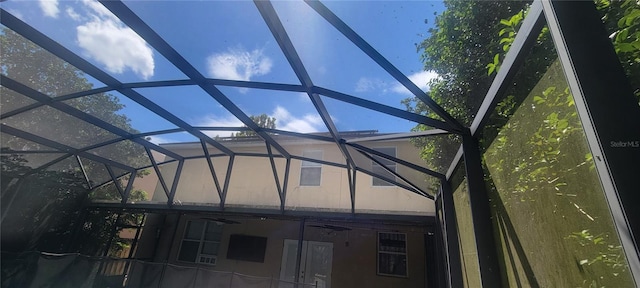 exterior space with ceiling fan and a lanai