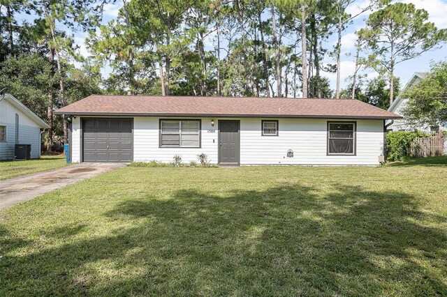 single story home with cooling unit, a garage, and a front lawn