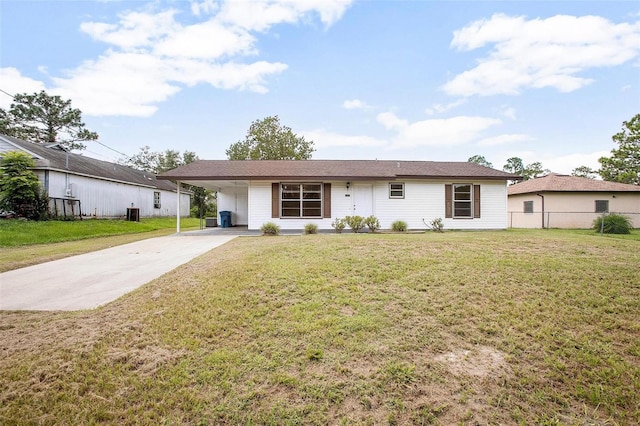 single story home featuring a front lawn and a carport