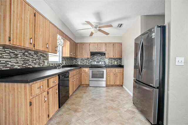 kitchen featuring ceiling fan, tasteful backsplash, appliances with stainless steel finishes, sink, and light tile patterned flooring