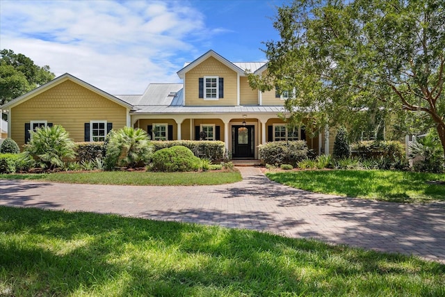 view of front of property with a front lawn