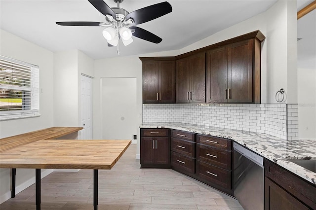 kitchen featuring light stone countertops, decorative backsplash, stainless steel dishwasher, light hardwood / wood-style flooring, and dark brown cabinets