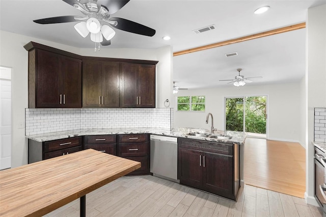 kitchen featuring light wood-type flooring, sink, kitchen peninsula, dishwasher, and light stone countertops