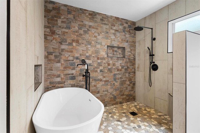 bathroom with separate shower and tub