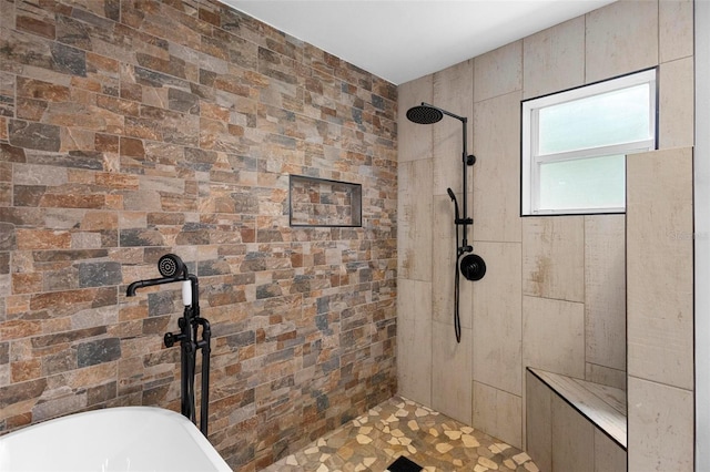 bathroom featuring shower with separate bathtub