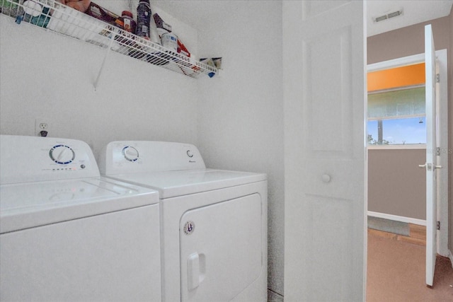 laundry room featuring separate washer and dryer