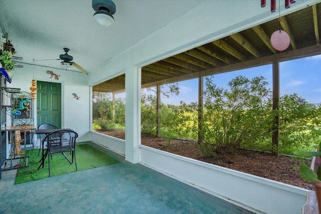 sunroom / solarium featuring ceiling fan