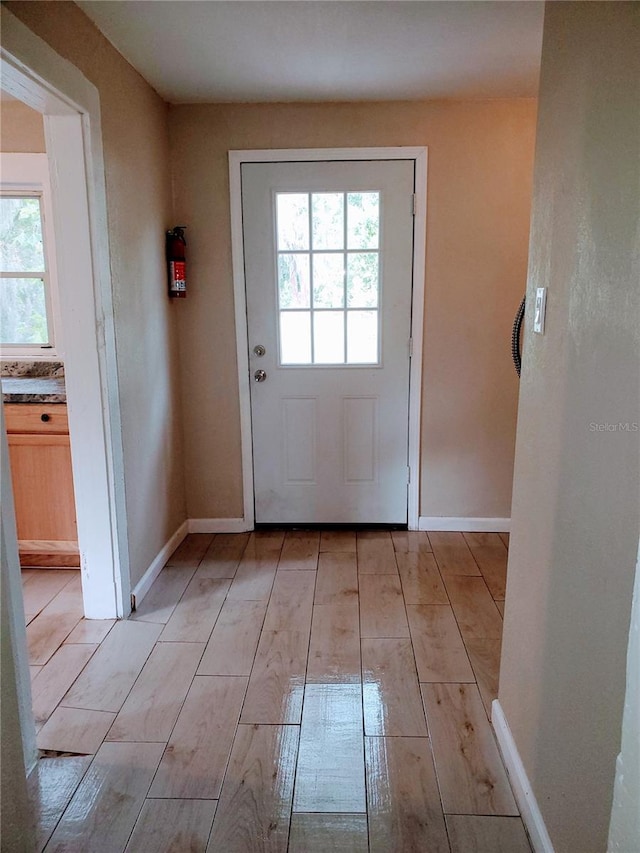 doorway to outside featuring light hardwood / wood-style flooring