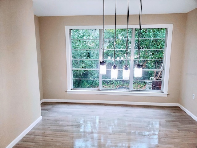 spare room featuring hardwood / wood-style floors