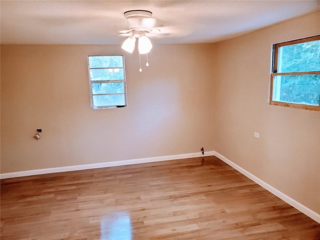 unfurnished room with ceiling fan and light hardwood / wood-style floors